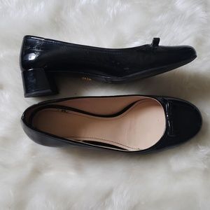Black patent leather Prada block heels